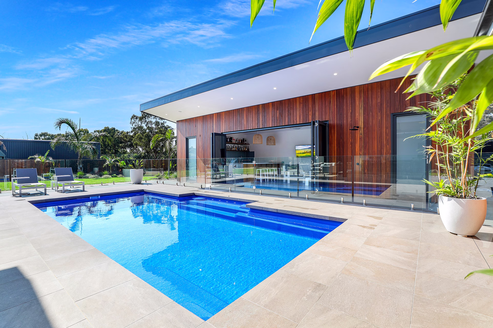 staycation ready transforming your backyard into a summer retreat with a fiberglass pool